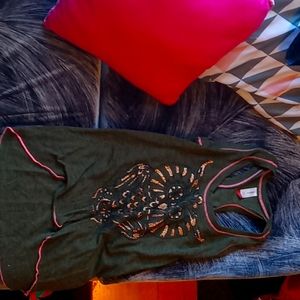 A green tank top with a glittery owl on the front.